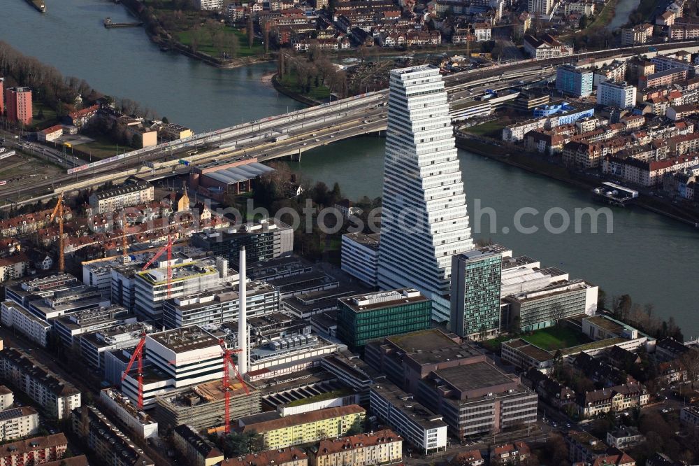 Basel from the bird's eye view: Roche Tower on the premises of the pharmaceutical company Hoffmann-La Roche AG, Basel, Switzerland. The Roche Tower is the tallest building in Switzerland. Planned by the Basel architects Herzog & de Meuron, the building will be the headquarters of Hoffmann-La Roche AG