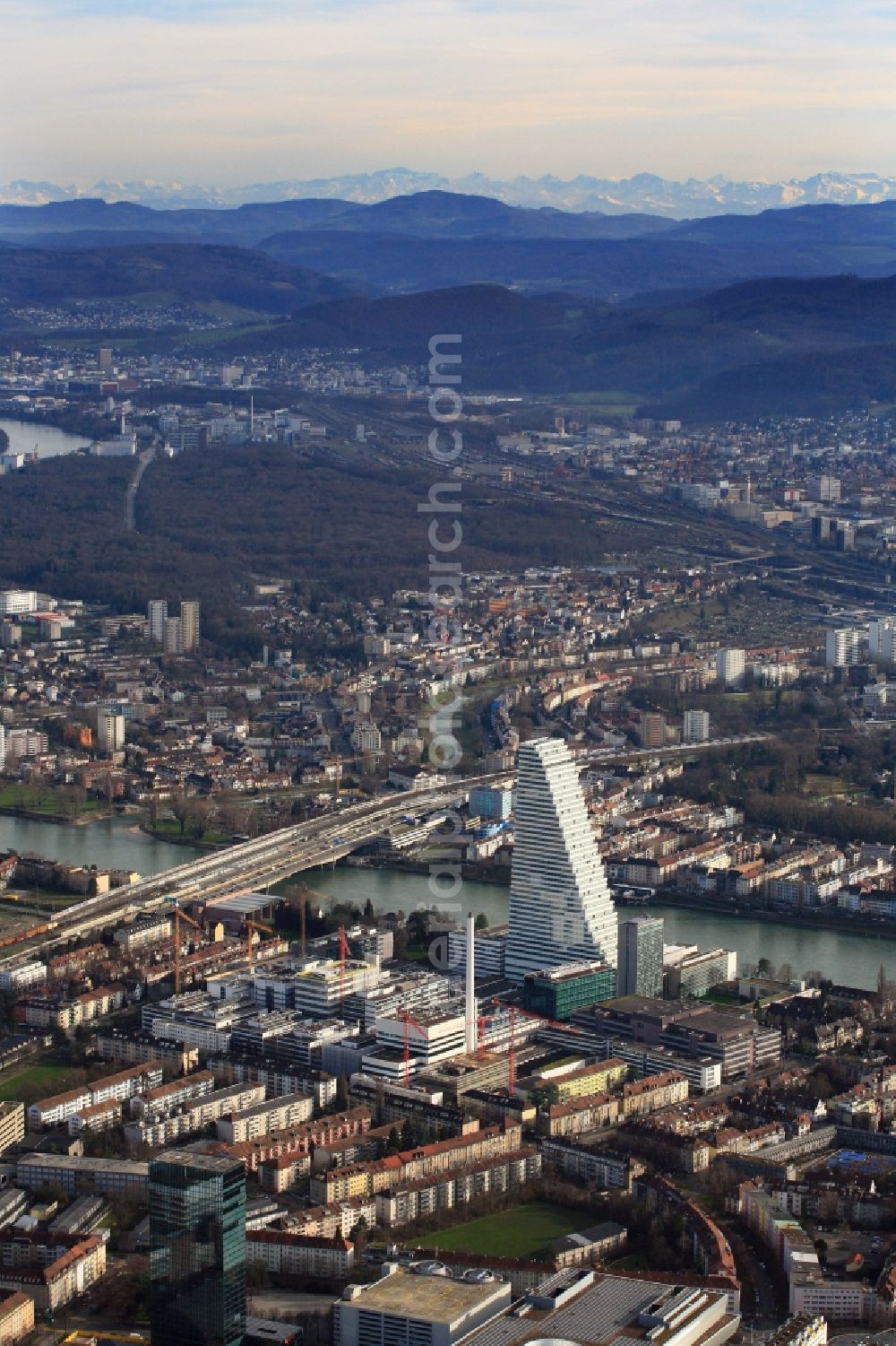 Aerial photograph Basel - Roche Tower on the premises of the pharmaceutical company Hoffmann-La Roche AG, Basel, Switzerland. The Roche Tower is the tallest building in Switzerland. Planned by the Basel architects Herzog & de Meuron, the building will be the headquarters of Hoffmann-La Roche AG