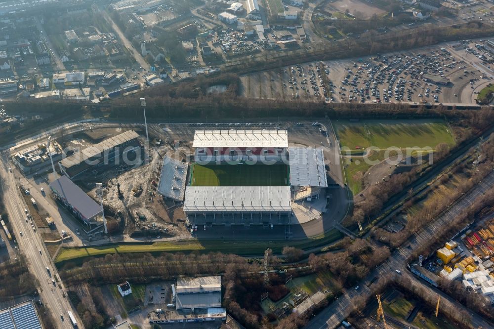 Essen from above - View at the new construction of a soccer stadium in the Hafenstraße in Essen in the federal state North Rhine-Westphalia. The new stadium becomes the home ground of Rot- Weis Essen and will also be used as an event and concert area. The for the construction responsible GVE Grundstücksverwaltung Stadt Essen GmbH has commissioned the Köster GmbH with the operation