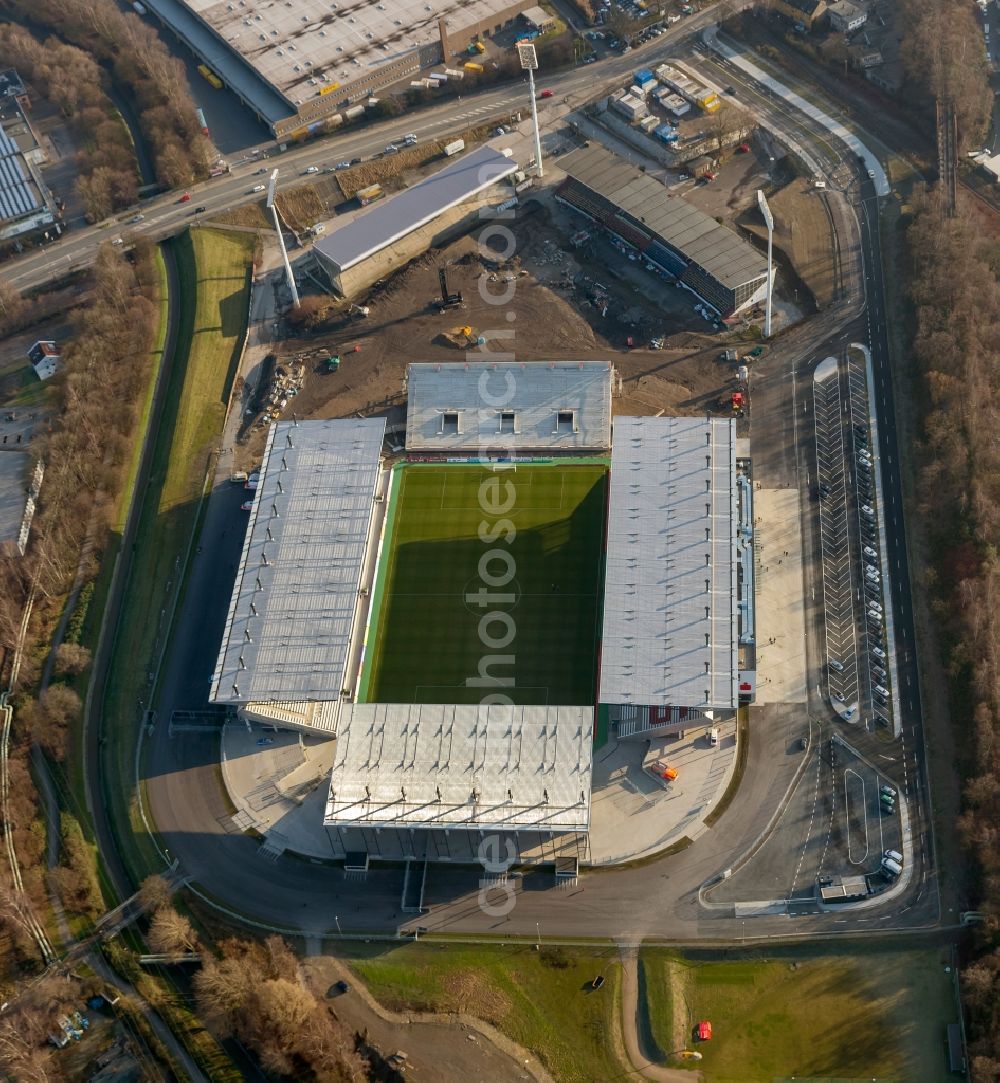 Aerial photograph Essen - View at the new construction of a soccer stadium in the Hafenstraße in Essen in the federal state North Rhine-Westphalia. The new stadium becomes the home ground of Rot- Weis Essen and will also be used as an event and concert area. The for the construction responsible GVE Grundstücksverwaltung Stadt Essen GmbH has commissioned the Köster GmbH with the operation