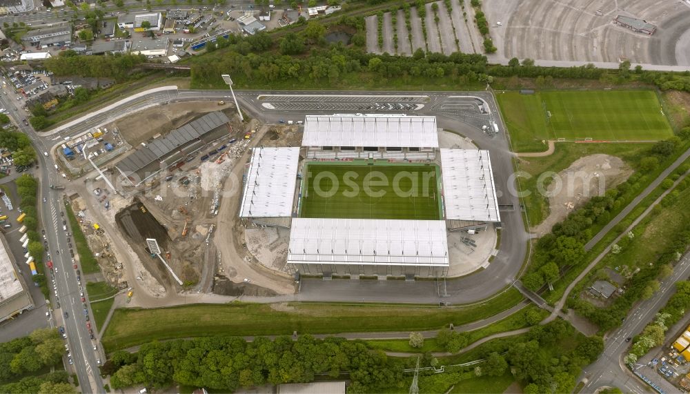 Aerial photograph Essen - View at the new construction of a soccer stadium in the Hafenstraße in Essen in the federal state North Rhine-Westphalia. The new stadium becomes the home ground of Rot- Weis Essen and will also be used as an event and concert area. The for the construction responsible GVE Grundstücksverwaltung Stadt Essen GmbH has commissioned the Köster GmbH with the operation