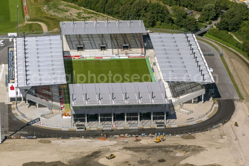 Essen from the bird's eye view: View at the new construction of a soccer stadium in the Hafenstraße in Essen in the federal state North Rhine-Westphalia. The new stadium becomes the home ground of Rot- Weis Essen and will also be used as an event and concert area. The for the construction responsible GVE Grundstücksverwaltung Stadt Essen GmbH has commissioned the Köster GmbH with the operation