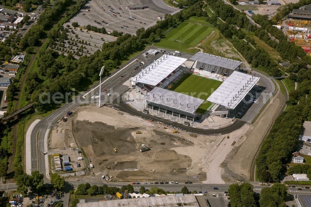 Aerial photograph Essen - View at the new construction of a soccer stadium in the Hafenstraße in Essen in the federal state North Rhine-Westphalia. The new stadium becomes the home ground of Rot- Weis Essen and will also be used as an event and concert area. The for the construction responsible GVE Grundstücksverwaltung Stadt Essen GmbH has commissioned the Köster GmbH with the operation