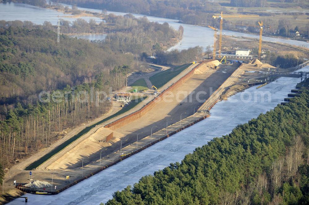 Aerial photograph Niederfinow - Blick auf die Baustelle des Neubaus des Schiffshebewerkes Niederfinow Nord durch die DSD Brückenbau GmbH, die Johann Bunte Bauunternehmung GmbH & Co. KG , Bilfinger Berger Ingenieurbau GmbH und die Siemag GmbH. Look at the new building of the boat lift Niederfinow North Bridge. The new building needed because the old boat lift of 1934 has now reached the end of its life. To maintain the function of the Havel-Oder waterway, it must therefore be replaced by a new building on schedule.