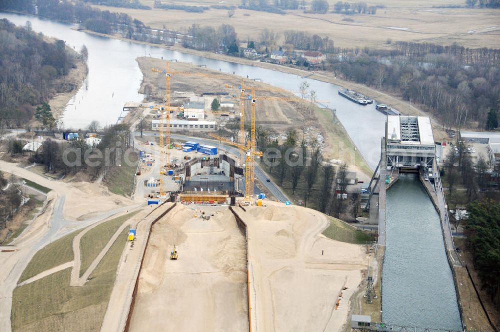 Aerial photograph Niederfinow - Blick auf die Baustelle des Neubaus des Schiffshebewerkes Niederfinow Nord durch die DSD Brückenbau GmbH, die Johann Bunte Bauunternehmung GmbH & Co. KG , Bilfinger Berger Ingenieurbau GmbH und die Siemag GmbH. Look at the new building of the boat lift Niederfinow North Bridge. The new building needed because the old boat lift of 1934 has now reached the end of its life. To maintain the function of the Havel-Oder waterway, it must therefore be replaced by a new building on schedule.