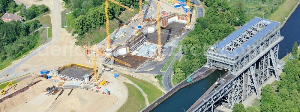 Niederfinow from above - Blick auf die Baustelle des Neubaus des Schiffshebewerkes Niederfinow Nord durch die DSD Brückenbau GmbH, die Johann Bunte Bauunternehmung GmbH & Co. KG , Bilfinger Berger Ingenieurbau GmbH und die Siemag GmbH. Look at the new building of the boat lift Niederfinow North Bridge. The new building needed because the old boat lift of 1934 has now reached the end of its life. To maintain the function of the Havel-Oder waterway, it must therefore be replaced by a new building on schedule.