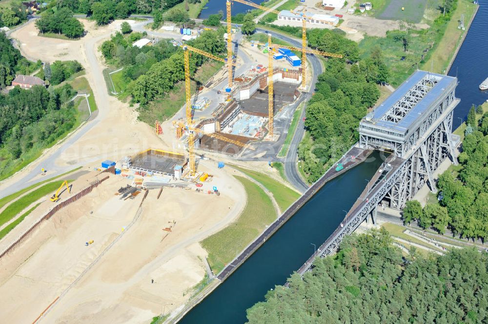 Niederfinow from the bird's eye view: Blick auf die Baustelle des Neubaus des Schiffshebewerkes Niederfinow Nord durch die DSD Brückenbau GmbH, die Johann Bunte Bauunternehmung GmbH & Co. KG , Bilfinger Berger Ingenieurbau GmbH und die Siemag GmbH. Look at the new building of the boat lift Niederfinow North Bridge. The new building needed because the old boat lift of 1934 has now reached the end of its life. To maintain the function of the Havel-Oder waterway, it must therefore be replaced by a new building on schedule.