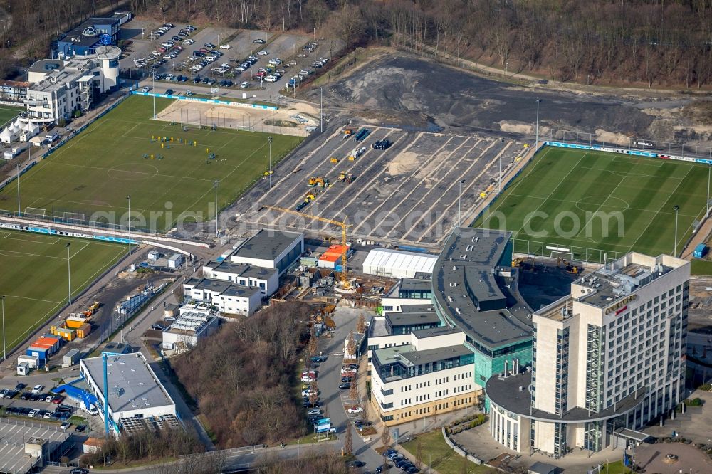 Gelsenkirchen from above - Construction of new Ensemble of sports grounds of FC Gelsenkirchen-Schalke 04 e.V. between the Ernst-Kuzorra-Weg and of the Parkallee in the district Gelsenkirchen-Ost in Gelsenkirchen in the state North Rhine-Westphalia, Germany. With a view of the building complex of the Hotel Courtyard Gelsenkirchen 