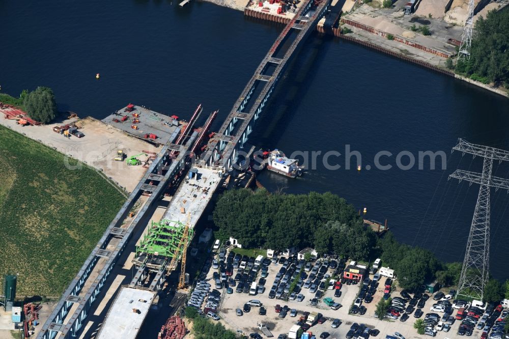 Aerial image Berlin - River - bridge construction over the Spree as part of the South-East-Connection (SOV) in the area of Schoeneweide in Berlin in Germany. The new bridge will connect Koepenicker Landstrasse and Rummelsburger Strasse