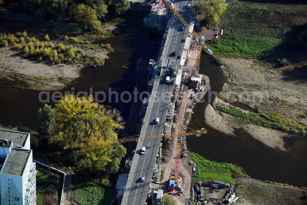 Aerial image Magdeburg - Construction site for the new construction of the road bridges - route and routing of the replacement power bridge train as a pylon bridge named Kaiser-Otto-Bridge and Queen-Editha-Bridge over the Zollelbe and the Alte Elbe on the Mittelstrasse in the district Werder in Magdeburg in the state Saxony- Anhalt, Germany