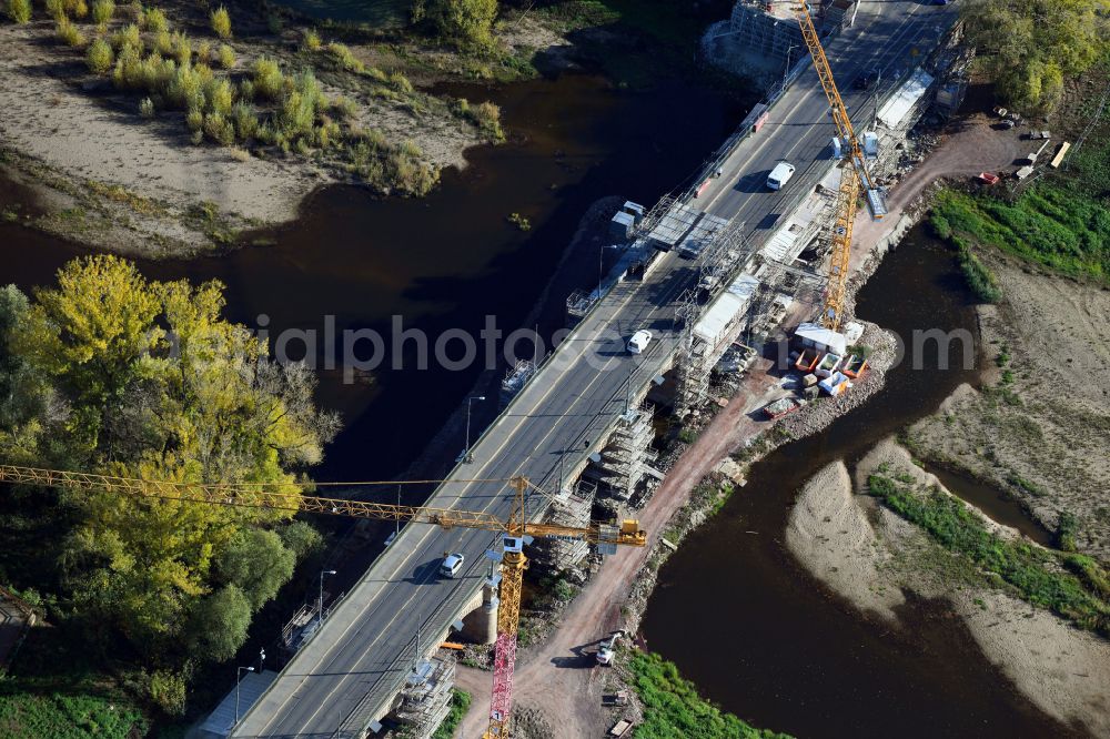 Aerial photograph Magdeburg - Construction site for the new construction of the road bridges - route and routing of the replacement power bridge train as a pylon bridge named Kaiser-Otto-Bridge and Queen-Editha-Bridge over the Zollelbe and the Alte Elbe on the Mittelstrasse in the district Werder in Magdeburg in the state Saxony- Anhalt, Germany