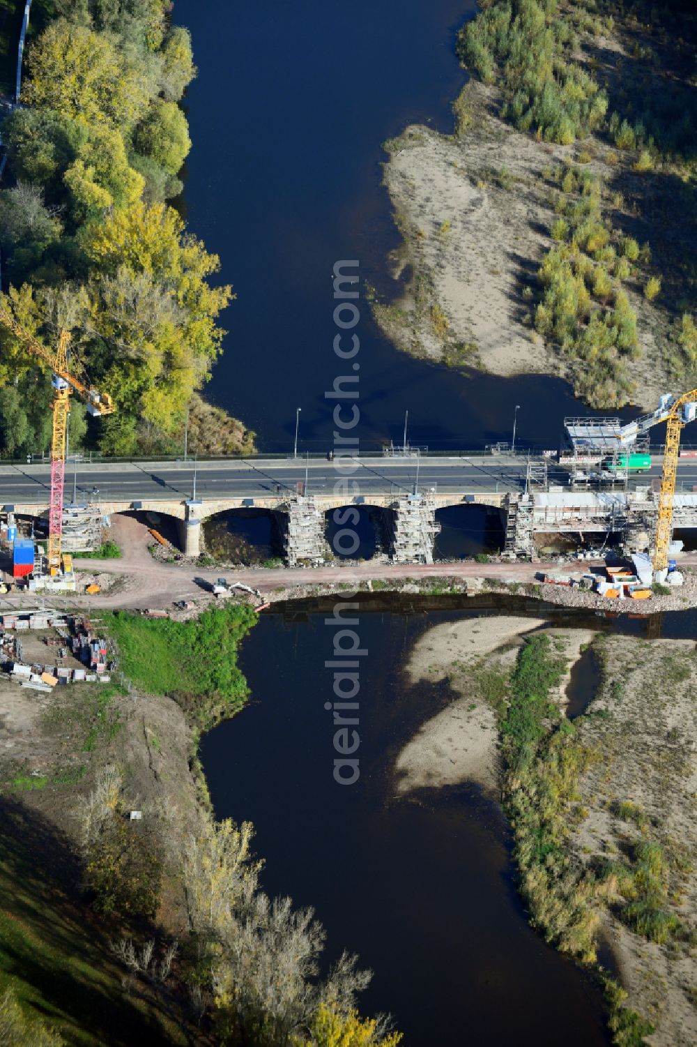 Aerial photograph Magdeburg - Construction site for the new construction of the road bridges - route and routing of the replacement power bridge train as a pylon bridge named Kaiser-Otto-Bridge and Queen-Editha-Bridge over the Zollelbe and the Alte Elbe on the Mittelstrasse in the district Werder in Magdeburg in the state Saxony- Anhalt, Germany