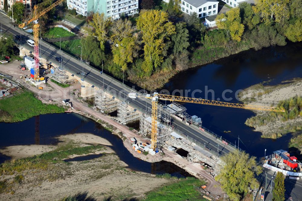 Magdeburg from the bird's eye view: Construction site for the new construction of the road bridges - route and routing of the replacement power bridge train as a pylon bridge named Kaiser-Otto-Bridge and Queen-Editha-Bridge over the Zollelbe and the Alte Elbe on the Mittelstrasse in the district Werder in Magdeburg in the state Saxony- Anhalt, Germany