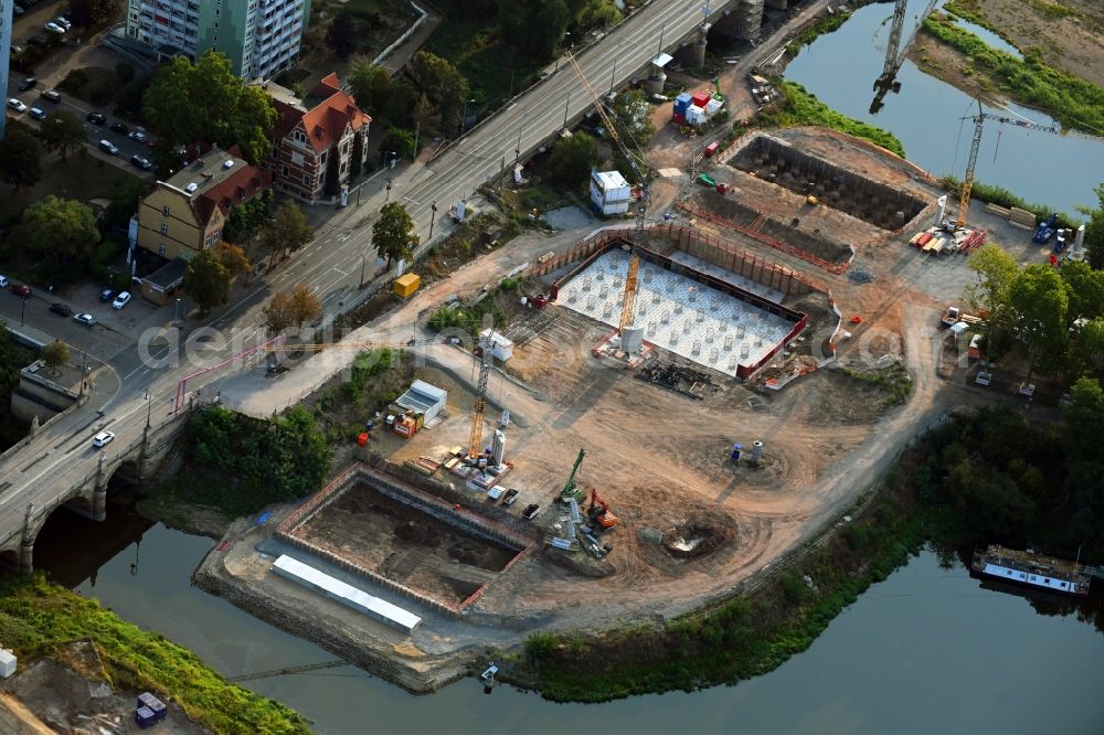 Aerial photograph Magdeburg - Construction site for the new construction of the road bridges - route and routing of the replacement power bridge train as a pylon bridge named Kaiser-Otto-Bridge and Queen-Editha-Bridge over the Zollelbe and the Alte Elbe on the Mittelstrasse in the district Werder in Magdeburg in the state Saxony- Anhalt, Germany