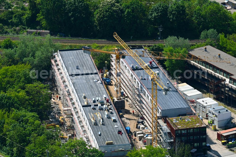 Aerial photograph Berlin - Construction site of a student dorm Studierendendorf EBA51 on street Eichbuschallee in the district Plaenterwald in Berlin, Germany