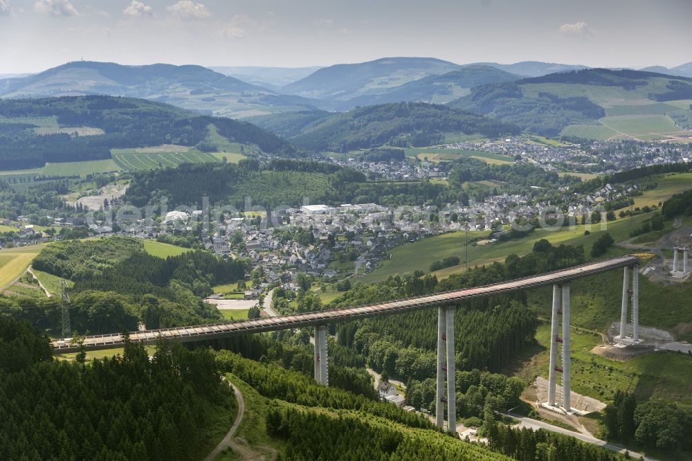 Bestwig from the bird's eye view: Viaduct Nuttlar under construction overlooking the municipality Bestwig in North Rhine-Westphalia