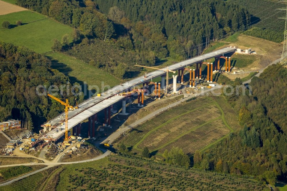 Bestwig from the bird's eye view: Viaduct Nuttlar under construction overlooking the municipality Bestwig in North Rhine-Westphalia