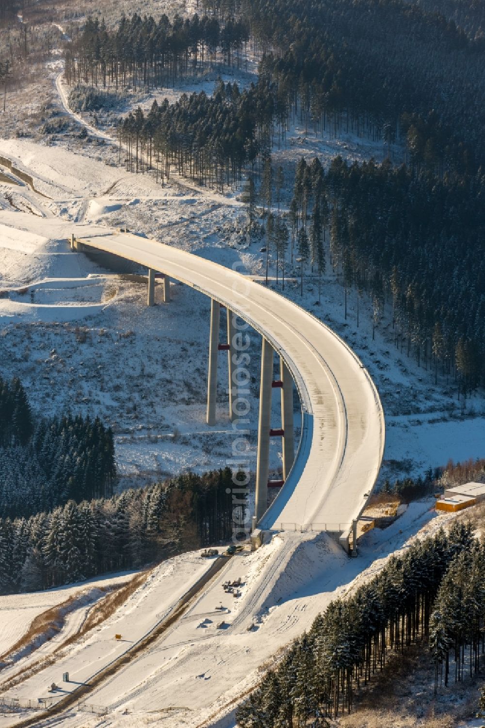 Bestwig from above - Wintry snowy viaduct Nuttlar under construction overlooking the municipality Bestwig in North Rhine-Westphalia