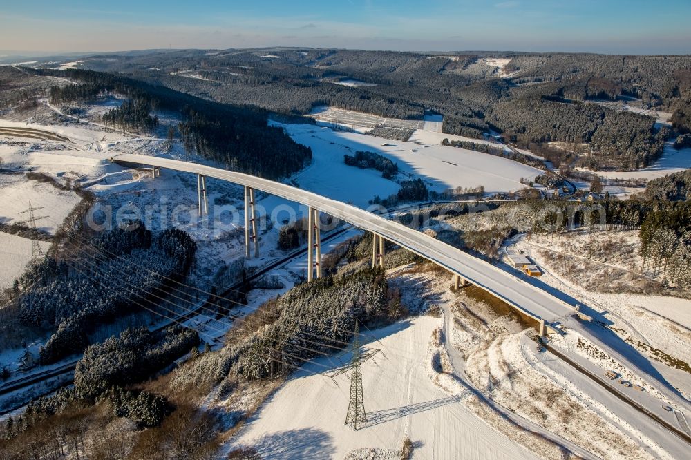 Bestwig from above - Wintry snowy viaduct Nuttlar under construction overlooking the municipality Bestwig in North Rhine-Westphalia