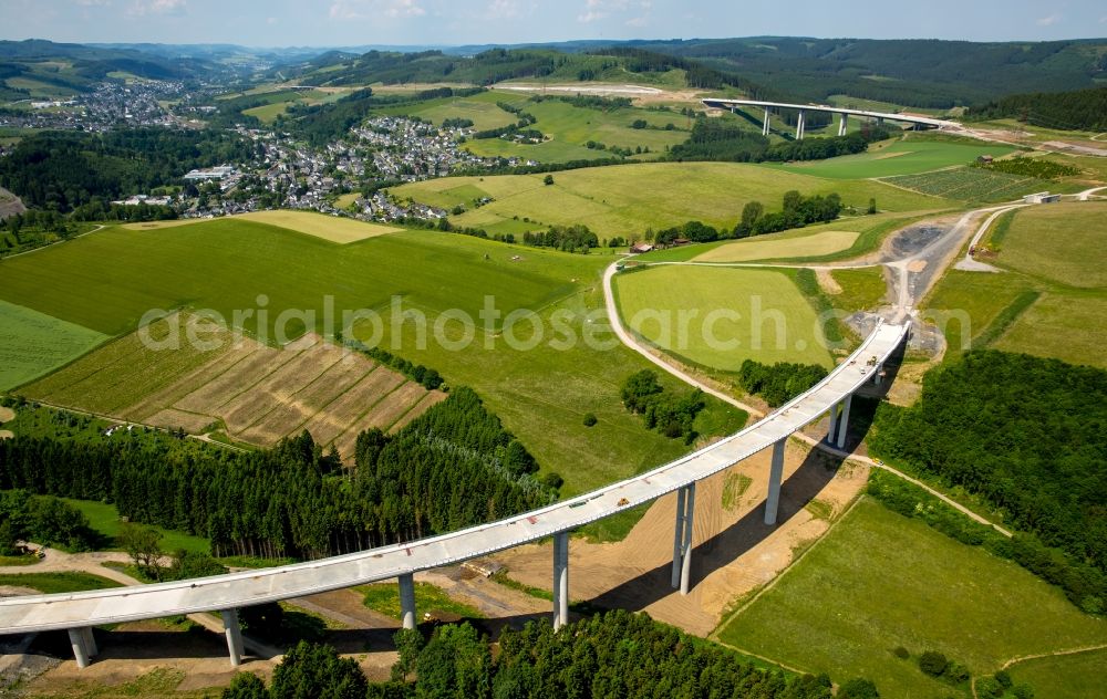 Bestwig from the bird's eye view: Viaduct Nuttlar under construction overlooking the municipality Bestwig in North Rhine-Westphalia