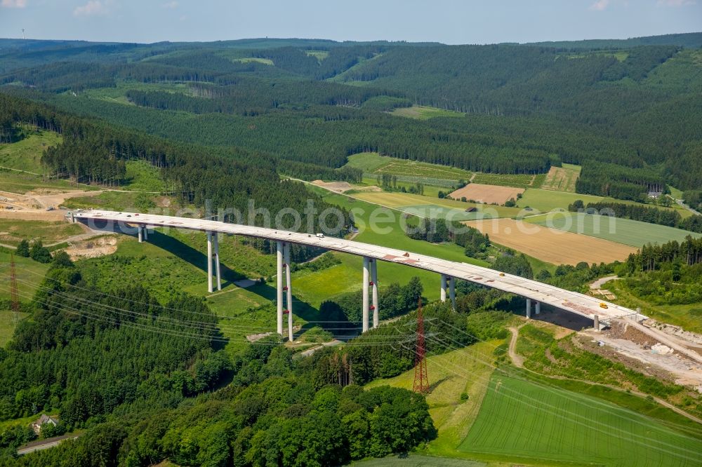 Bestwig from the bird's eye view: Viaduct Nuttlar under construction overlooking the municipality Bestwig in North Rhine-Westphalia