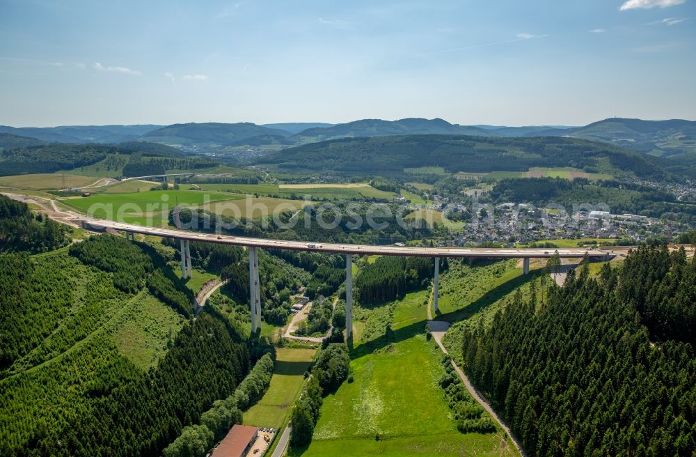 Bestwig from the bird's eye view: Viaduct Nuttlar under construction overlooking the municipality Bestwig in North Rhine-Westphalia