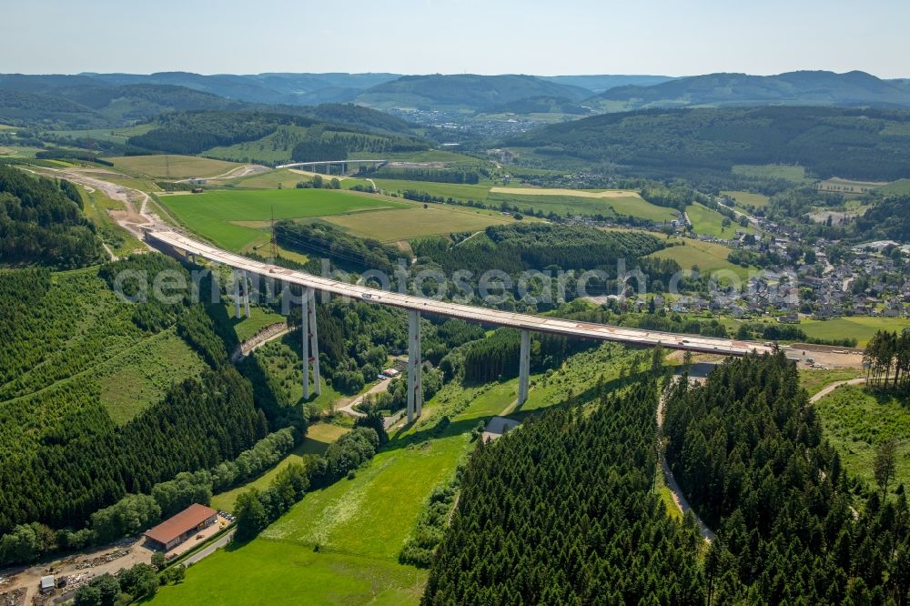 Bestwig from the bird's eye view: Viaduct Nuttlar under construction overlooking the municipality Bestwig in North Rhine-Westphalia