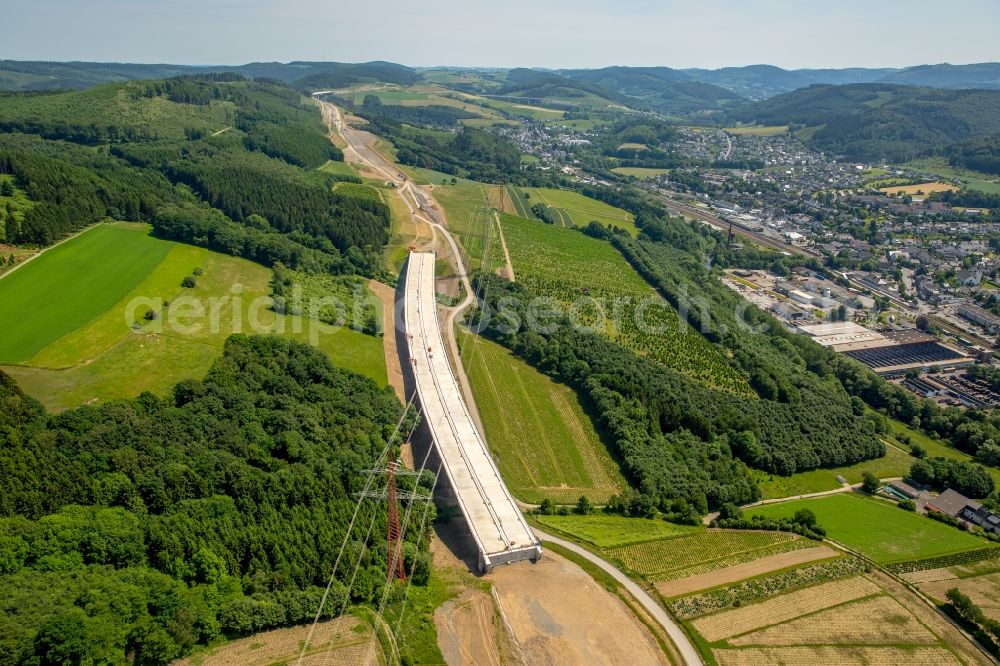 Bestwig from the bird's eye view: Viaduct Nuttlar under construction overlooking the municipality Bestwig in North Rhine-Westphalia