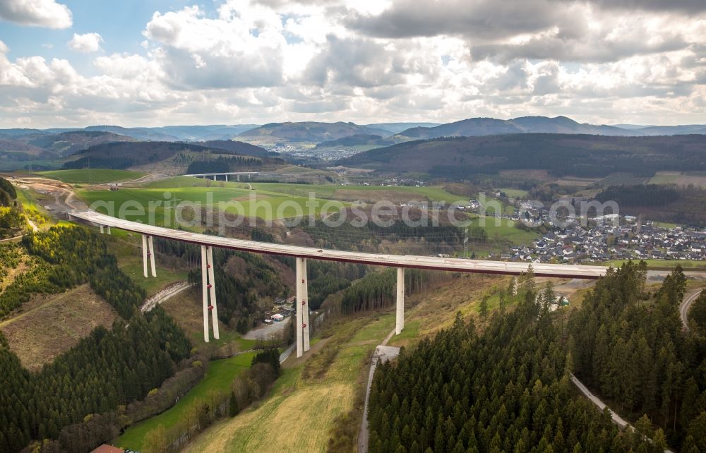 Bestwig from the bird's eye view: Viaduct Nuttlar under construction overlooking the municipality Bestwig in North Rhine-Westphalia