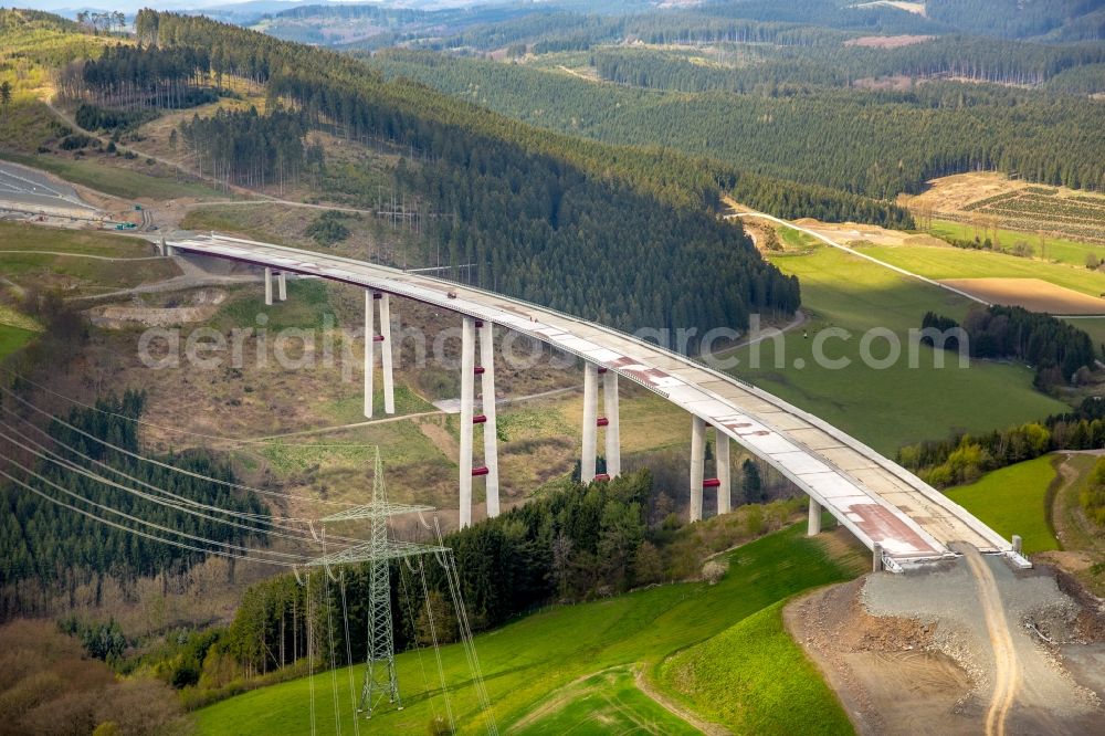 Bestwig from the bird's eye view: Viaduct Nuttlar under construction overlooking the municipality Bestwig in North Rhine-Westphalia