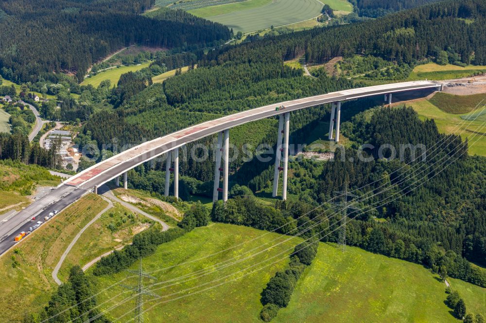 Bestwig from the bird's eye view: Viaduct Nuttlar under construction overlooking the municipality Bestwig at Sauerland in North Rhine-Westphalia