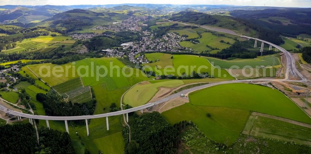 Bestwig from the bird's eye view: Viaduct Nuttlar under construction overlooking the municipality Bestwig in North Rhine-Westphalia