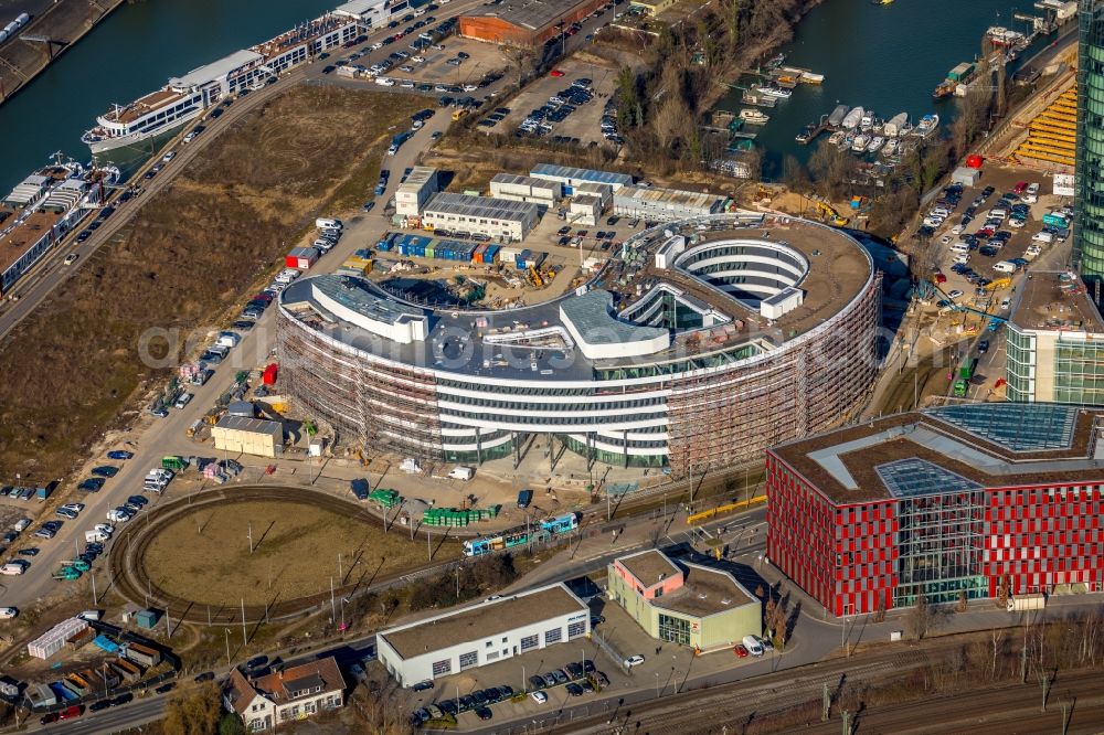 Düsseldorf from the bird's eye view: Construction site for the new building trivago-Zentrale on Kesselstrasse in the district Medienhafen in Duesseldorf in the state North Rhine-Westphalia