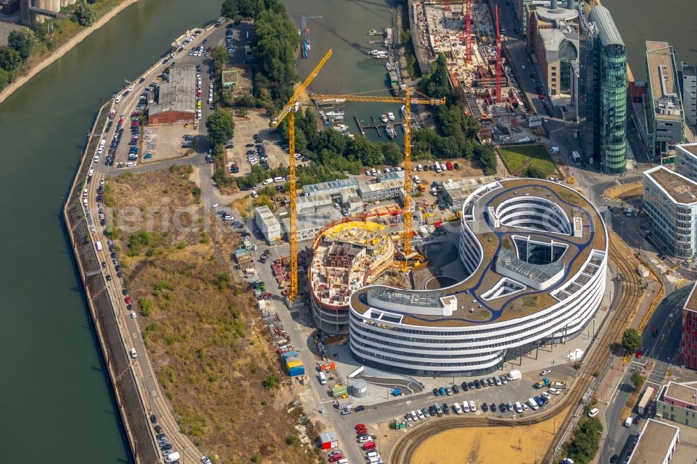 Düsseldorf from the bird's eye view: Construction site for the new building trivago-Zentrale on Kesselstrasse in the district Medienhafen in Duesseldorf in the state North Rhine-Westphalia