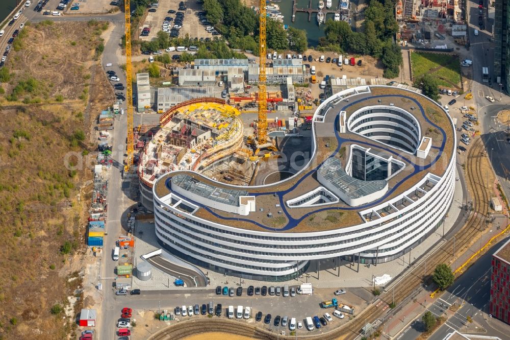 Düsseldorf from the bird's eye view: Construction site for the new building trivago-Zentrale on Kesselstrasse in the district Medienhafen in Duesseldorf in the state North Rhine-Westphalia