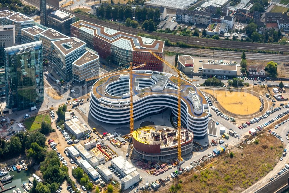 Düsseldorf from the bird's eye view: Construction site for the new building trivago-Zentrale on Kesselstrasse in the district Medienhafen in Duesseldorf in the state North Rhine-Westphalia