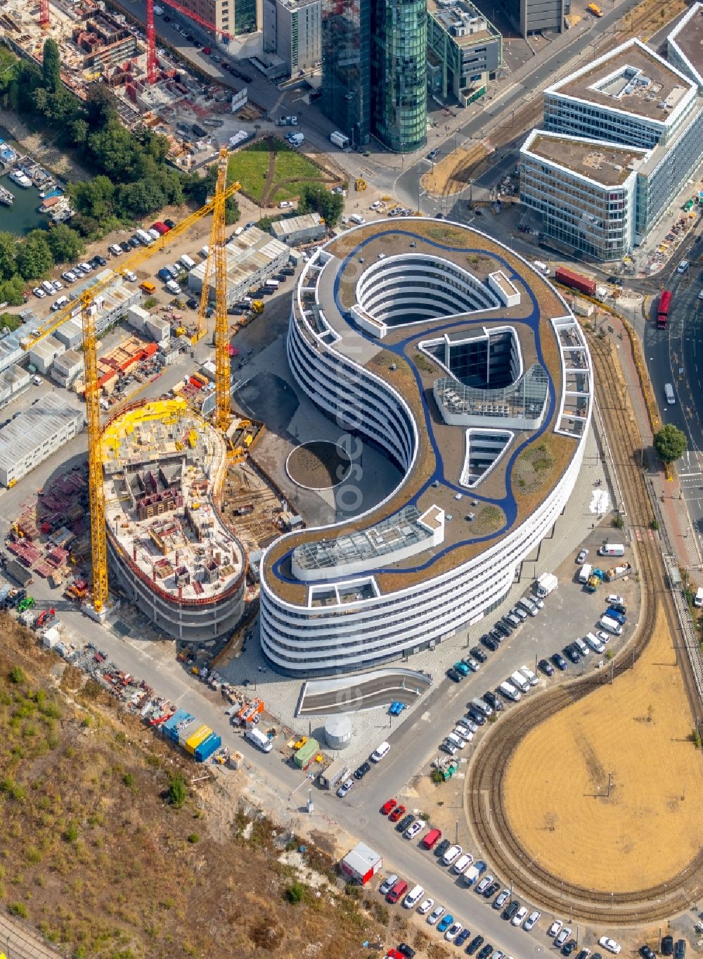 Düsseldorf from the bird's eye view: Construction site for the new building trivago-Zentrale on Kesselstrasse in the district Medienhafen in Duesseldorf in the state North Rhine-Westphalia