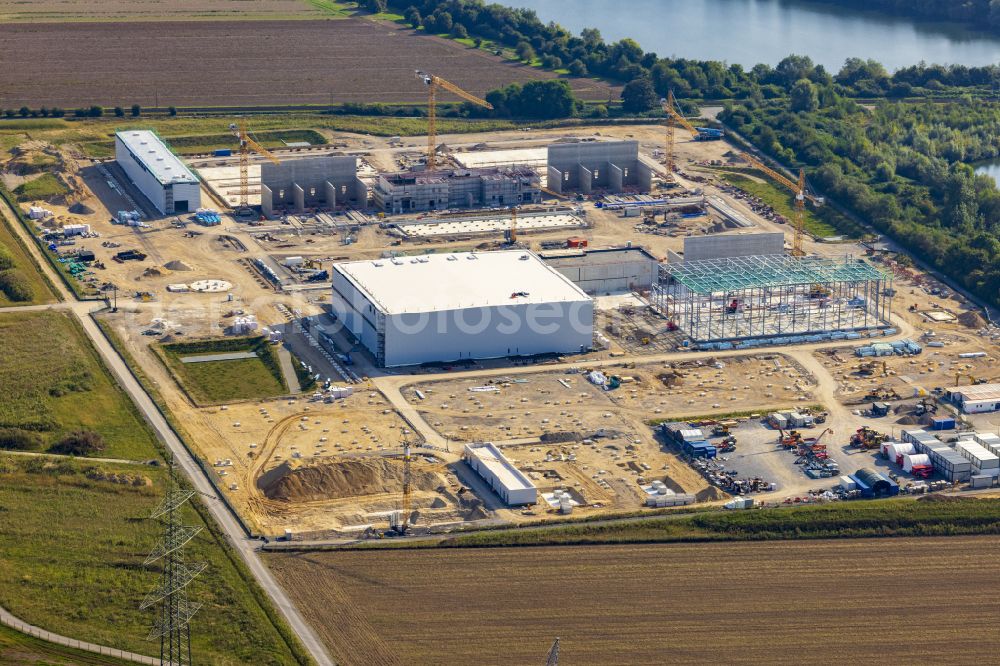 Aerial photograph Osterath - Construction site for the new construction of the substation, converter for voltage conversion and electrical power supply on the street Alte Landwehr in Osterath in the state of North Rhine-Westphalia, Germany