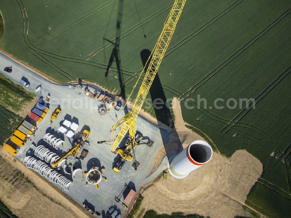 Heinsdorfergrund from above - Agricultural land and fields with new construction site for the construction of wind turbines on street K7810 in Heinsdorfergrund in the state Saxony, Germany