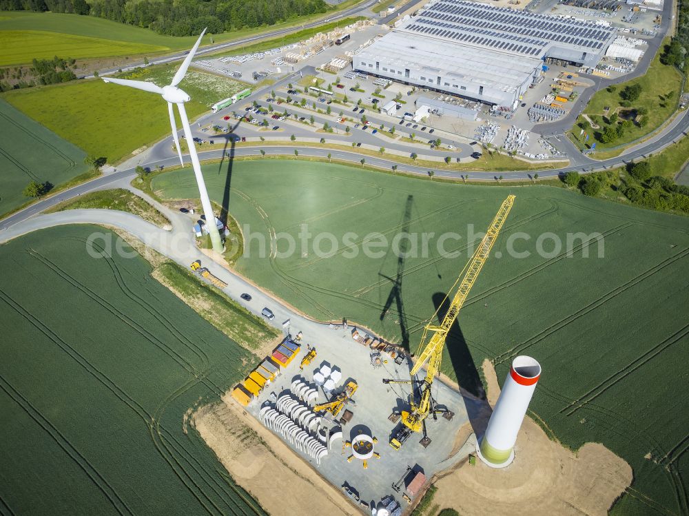 Heinsdorfergrund from the bird's eye view: Agricultural land and fields with new construction site for the construction of wind turbines on street K7810 in Heinsdorfergrund in the state Saxony, Germany