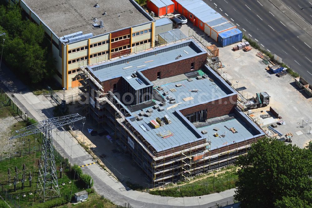 Berlin from above - New construction of a residential and commercial building on street Maerkische Allee in the district Marzahn in Berlin, Germany