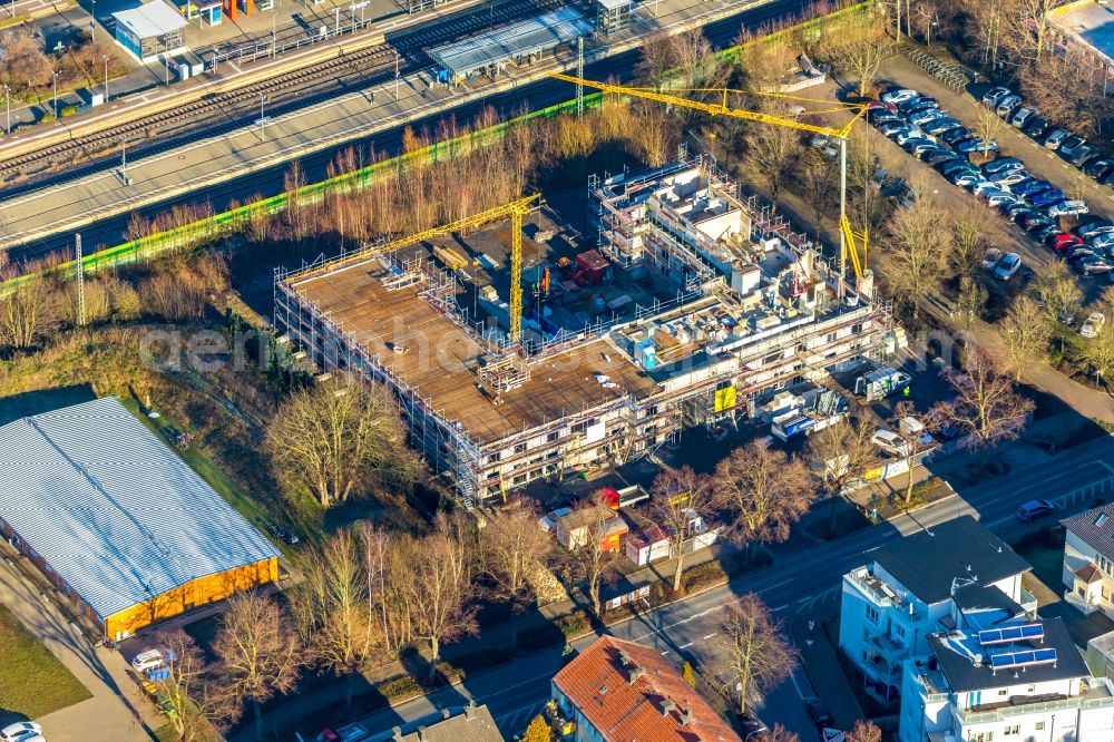 Aerial photograph Holzwickede - New construction of a residential and commercial building on Bahnhofstrasse in Holzwickede in the state North Rhine-Westphalia, Germany