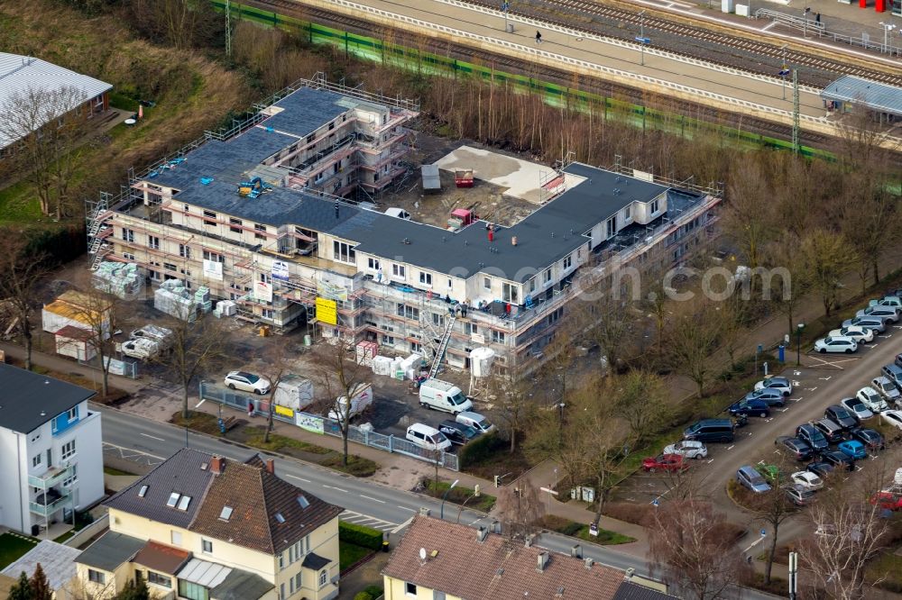 Aerial photograph Holzwickede - New construction of a residential and commercial building on Bahnhofstrasse in Holzwickede in the state North Rhine-Westphalia, Germany