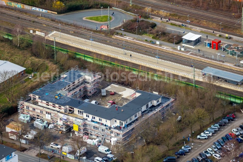 Holzwickede from above - New construction of a residential and commercial building on Bahnhofstrasse in Holzwickede in the state North Rhine-Westphalia, Germany