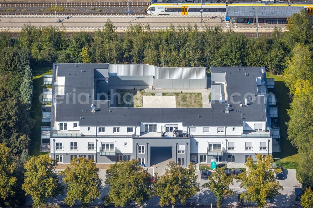 Holzwickede from above - New construction of a residential and commercial building on Bahnhofstrasse in Holzwickede in the state North Rhine-Westphalia, Germany