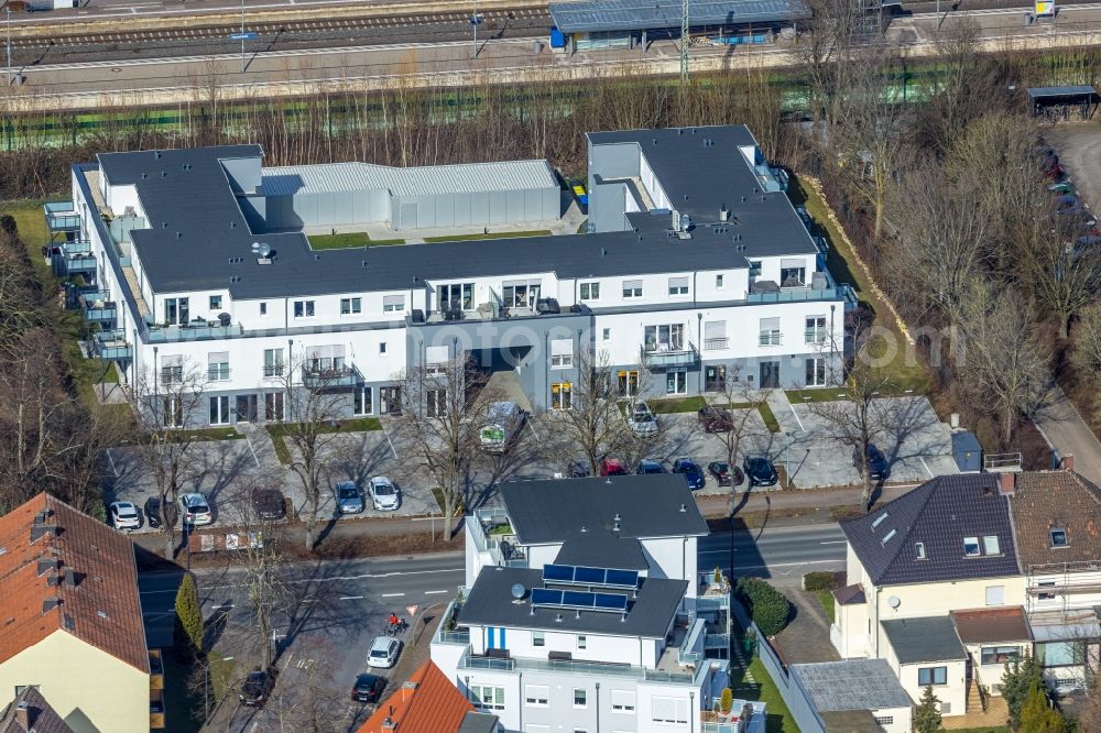 Aerial photograph Holzwickede - New construction of a residential and commercial building on Bahnhofstrasse in Holzwickede at Ruhrgebiet in the state North Rhine-Westphalia, Germany