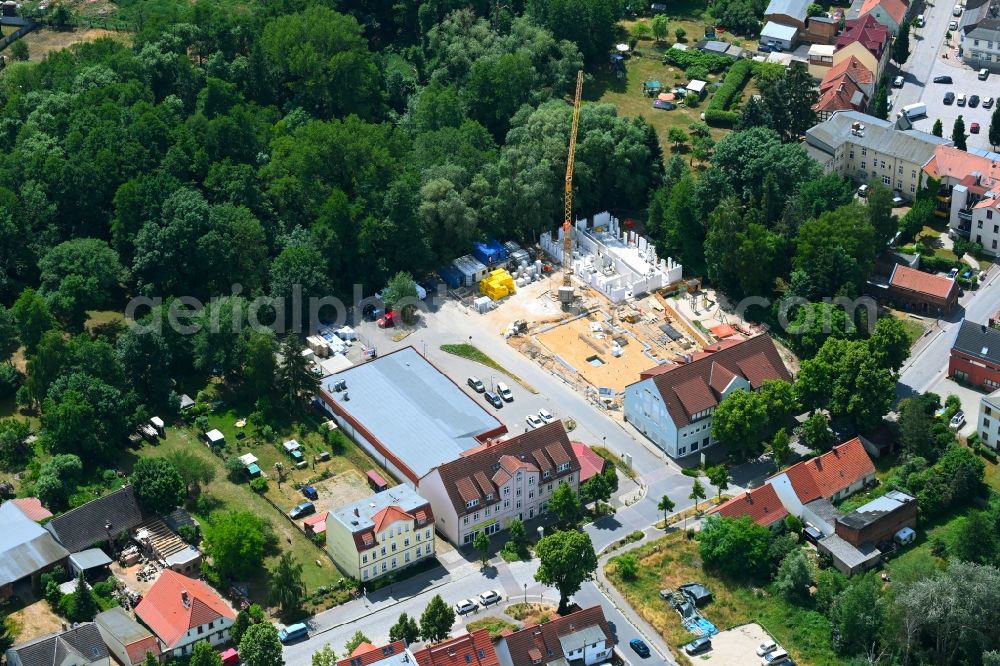 Werneuchen from above - New construction of a residential and commercial building Breite Strasse in Werneuchen in the state Brandenburg, Germany