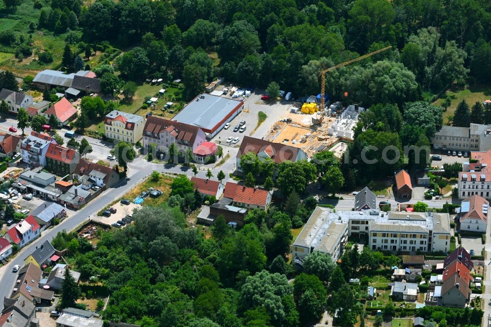 Werneuchen from above - New construction of a residential and commercial building Breite Strasse in Werneuchen in the state Brandenburg, Germany