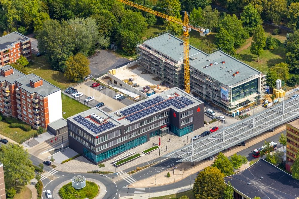 Aerial image Bergkamen - New construction of a residential and commercial building with Buerotrakt on Hubert-Biernat-Strasse / Toeddinghauser Strasse in Bergkamen in the state North Rhine-Westphalia, Germany. The picture also shows the building of the Sparkasse Bergkamen-Boenen, which was planned by farwick + grote Architects BDA town planner PartmbB 