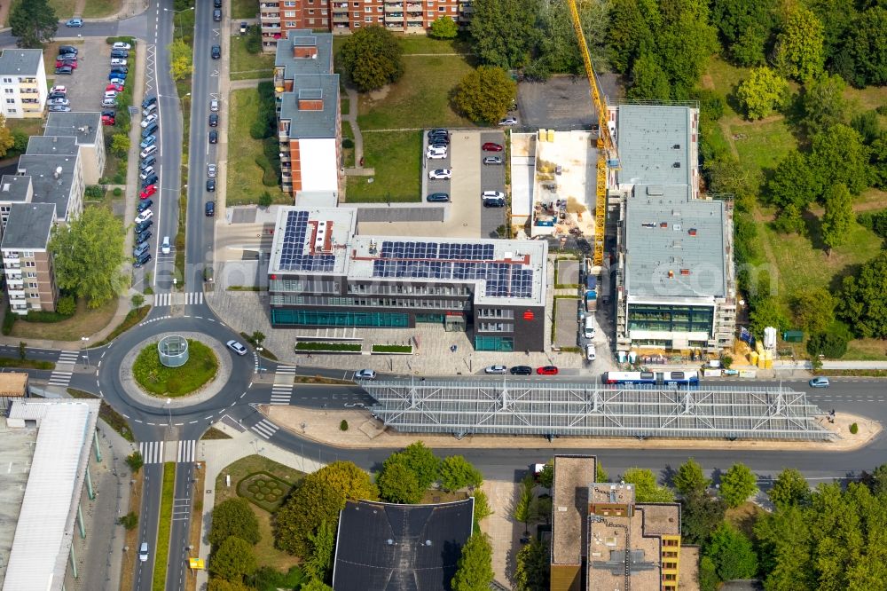 Aerial photograph Bergkamen - New construction of a residential and commercial building with Buerotrakt on Hubert-Biernat-Strasse / Toeddinghauser Strasse in Bergkamen in the state North Rhine-Westphalia, Germany. The picture also shows the building of the Sparkasse Bergkamen-Boenen, which was planned by farwick + grote Architects BDA town planner PartmbB 